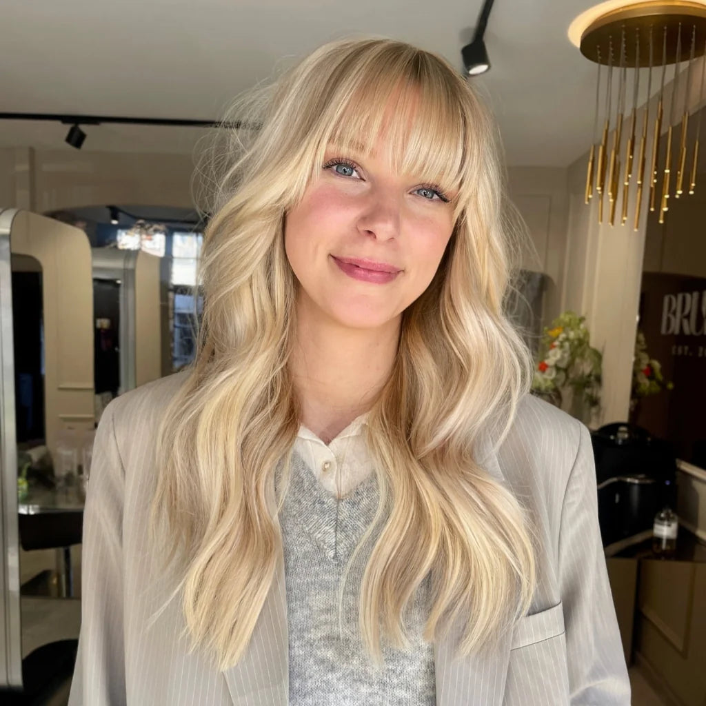 Layered haircut with bangs and hair extensions and BRUSH Amsterdam hair salon.