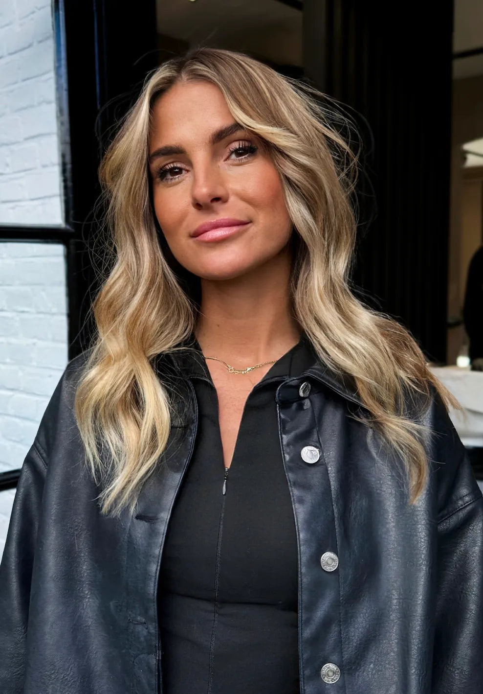 Dark blonde tape-in hair extensions at BRUSH Amsterdam