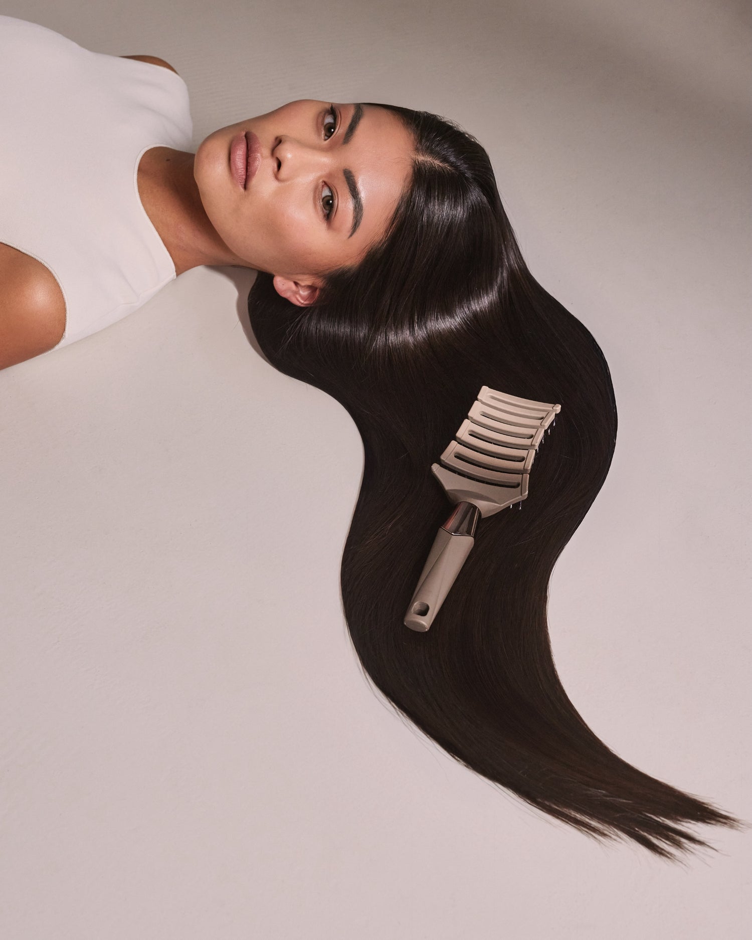 MANE MAVEN ZIGZAG hair brush in action on sleek Asian hair - effortless detangling and smooth, frizz-free results.