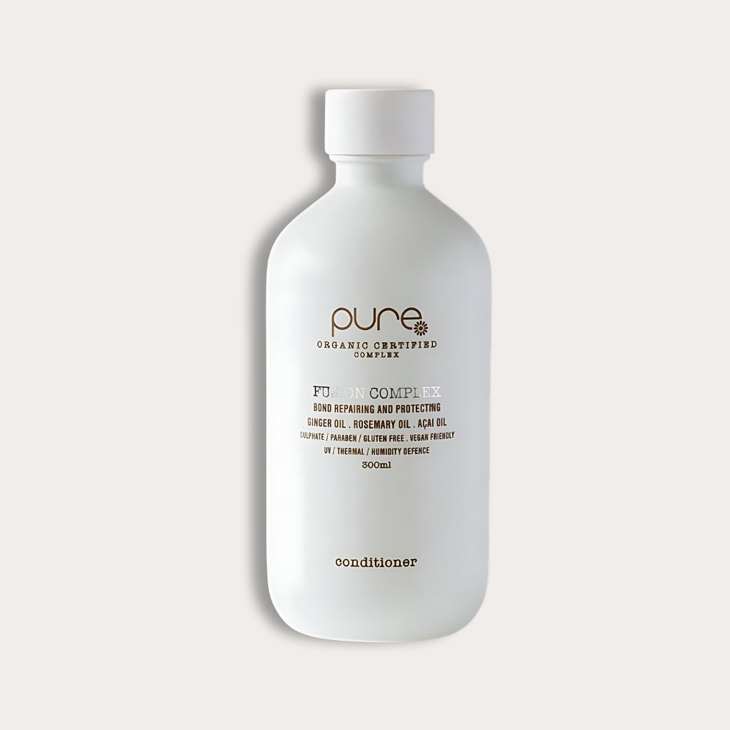 Pure Organic Fusion Complex Conditioner strengthens and repairs hair with bond-building technology. It nourishes with organic oils like ginger and açai.